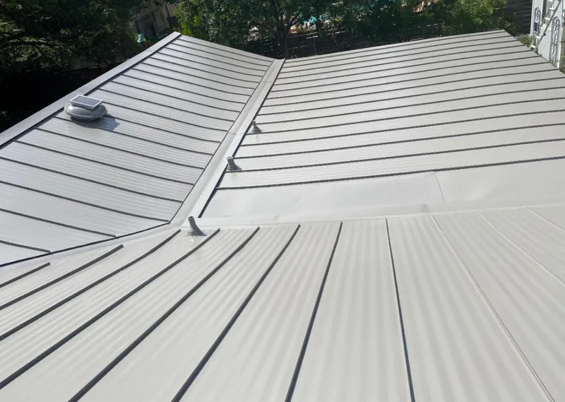 Solar attic fan installed on a metal roof for Roof Ventilation in Makawao